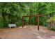 A classic swing set with a bench offers a peaceful spot for relaxation and outdoor fun in a quiet, wooded setting at 1552 Brentwood Dr, Marietta, GA 30062