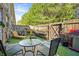 Private fenced backyard featuring a patio area, perfect for outdoor dining and relaxation at 2069 Brightleaf Way # 123, Marietta, GA 30060