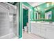 Bright bathroom features a glass shower, toilet, and double sink vanity with modern fixtures and stylish gold mirrors at 2069 Brightleaf Way # 123, Marietta, GA 30060