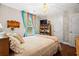 Inviting bedroom with wood floors, bright window, and shelving, offering a peaceful retreat at 2069 Brightleaf Way # 123, Marietta, GA 30060