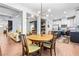 This dining area features a stylish chandelier and flows seamlessly into the kitchen and living spaces at 2069 Brightleaf Way # 123, Marietta, GA 30060