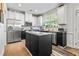 Modern kitchen with an island, stainless steel appliances, granite countertops, and white cabinets at 2069 Brightleaf Way # 123, Marietta, GA 30060