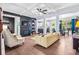 Open-concept living room with coffered ceilings, hardwood floors, fireplace, and modern decor at 2069 Brightleaf Way # 123, Marietta, GA 30060