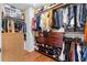 Organized walk-in closet with ample hanging space, shelves, and storage drawers, perfect for maximizing space at 2069 Brightleaf Way # 123, Marietta, GA 30060