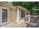 Relaxing back deck featuring a wood deck and railings, and outdoor furniture with a view of the backyard at 300 Alcovy Way, Covington, GA 30014