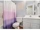 Bright bathroom with a shower and tub combination, a stylish vanity, and sleek wood-look flooring at 300 Alcovy Way, Covington, GA 30014