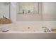 Close up of the bathtub in the bathroom with tile backsplash and window at 300 Alcovy Way, Covington, GA 30014