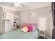 Bright bedroom features a ceiling fan, nice furnishings and decor with a large window to let the sunshine in at 300 Alcovy Way, Covington, GA 30014