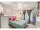 Cozy bedroom featuring colorful accents, ample natural light, and plush bedding at 300 Alcovy Way, Covington, GA 30014