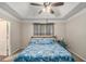 Bedroom with a view of the tray ceiling, large window, and neutral-colored walls at 300 Alcovy Way, Covington, GA 30014