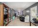 Spacious bedroom featuring 2 twin beds, a bookshelf, and a ceiling fan at 300 Alcovy Way, Covington, GA 30014
