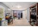Spacious carpeted bonus room featuring a bookshelf, exercise equipment, and an abundance of storage areas at 300 Alcovy Way, Covington, GA 30014