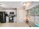 Eat-in kitchen featuring stainless steel appliances, white cabinets, and a bright window with natural light at 300 Alcovy Way, Covington, GA 30014