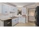 Bright kitchen showcasing white cabinets, wood countertops and a seamless connection to the dining area at 300 Alcovy Way, Covington, GA 30014