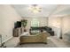 Bright living room with neutral walls, plush chaise lounge, comfortable grey sofa and staircase to another level at 300 Alcovy Way, Covington, GA 30014