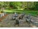 Backyard firepit area with Adirondack chairs and manicured landscaping at 4584 E Conway Nw Dr, Atlanta, GA 30327