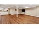 Large finished basement with wood-look flooring, wet bar, and recessed lighting, perfect for entertaining at 4584 E Conway Nw Dr, Atlanta, GA 30327