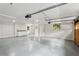 Large open garage space with concrete floors, white walls, and natural light, ideal for storage or workshop at 4584 E Conway Nw Dr, Atlanta, GA 30327