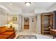 Finished basement room with tile floor, built-in shelves, and view to other basement area at 4584 E Conway Nw Dr, Atlanta, GA 30327