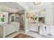 Bright bathroom with dual sinks, marble counters, and walk-in shower with glass door at 4584 E Conway Nw Dr, Atlanta, GA 30327