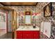 Eccentric bathroom with a red vanity, black and white wallpaper, and a gold-trimmed shower at 4584 E Conway Nw Dr, Atlanta, GA 30327