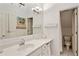 Bathroom with modern sink, vanity, white cabinets, and tiled floors at 4584 E Conway Nw Dr, Atlanta, GA 30327