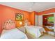 Inviting bedroom with twin beds, complemented by a bright color scheme, and a view into the office at 4584 E Conway Nw Dr, Atlanta, GA 30327