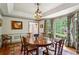 Bright dining room with round table, bay window, hardwood floors, and stylish decor at 4584 E Conway Nw Dr, Atlanta, GA 30327