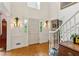 Bright foyer with white trim, hardwood floors, and elegant sconces, showcasing a classic design at 4584 E Conway Nw Dr, Atlanta, GA 30327