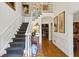 Grand foyer features a staircase, chandelier, and hardwood floors, creating a welcoming entrance at 4584 E Conway Nw Dr, Atlanta, GA 30327