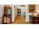 Inviting hallway with hardwood floors and classic furnishings, creating a warm transition between rooms at 4584 E Conway Nw Dr, Atlanta, GA 30327