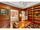 Well-appointed home office, custom bookshelves, and a view into an adjacent bedroom, creating an inspiring workspace at 4584 E Conway Nw Dr, Atlanta, GA 30327