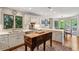 White kitchen with stainless steel appliances, custom cabinets, island, and hardwood floors at 4584 E Conway Nw Dr, Atlanta, GA 30327