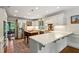 Bright and airy kitchen with stainless steel appliances, white cabinets, and wood floors at 4584 E Conway Nw Dr, Atlanta, GA 30327