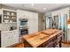 Well-equipped kitchen with stainless steel appliances, wooden island, and custom white cabinets at 4584 E Conway Nw Dr, Atlanta, GA 30327