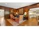 Sophisticated living room with rich wood paneling, a vibrant rug, and comfortable seating at 4584 E Conway Nw Dr, Atlanta, GA 30327