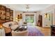 Bright living room with a cozy atmosphere, featuring a decorative screen and ample natural light at 4584 E Conway Nw Dr, Atlanta, GA 30327