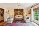 Elegant living room featuring a decorative screen, plush seating, and a stylish rug creating a warm and inviting atmosphere at 4584 E Conway Nw Dr, Atlanta, GA 30327