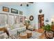 Bright sun room with floor-to-ceiling windows, cozy seating, zebra rug, and view to another room at 4584 E Conway Nw Dr, Atlanta, GA 30327
