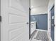 Bathroom features a white sink vanity with sleek hardware and modern fixtures, plus a decorative rug at 509 Azalea Bloom Dr, Loganville, GA 30052