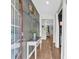 Welcoming entryway with stylish console table, coat hooks, and beautiful wood-look flooring at 509 Azalea Bloom Dr, Loganville, GA 30052