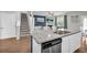 Stylish kitchen boasts granite countertops, stainless steel appliances, and an open layout with island seating at 509 Azalea Bloom Dr, Loganville, GA 30052