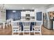 Bright and modern kitchen featuring stainless steel appliances, granite countertops, and central island at 509 Azalea Bloom Dr, Loganville, GA 30052