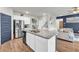 A kitchen features stainless steel appliances, granite countertops, and a center island at 509 Azalea Bloom Dr, Loganville, GA 30052