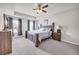 Spacious main bedroom with ceiling fan, tray ceiling, and a relaxing atmosphere at 509 Azalea Bloom Dr, Loganville, GA 30052