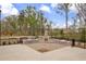 Outdoor kitchen featuring a stone fireplace, built-in grills, and ample counter space for entertaining at 509 Azalea Bloom Dr, Loganville, GA 30052