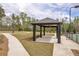 Community pavilion featuring ceiling fan, seating, and walking path for outdoor relaxation and enjoyment at 509 Azalea Bloom Dr, Loganville, GA 30052