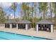 Community pool featuring cabanas, offering shaded seating and resort-style living for residents' enjoyment at 509 Azalea Bloom Dr, Loganville, GA 30052
