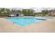 Community pool with separate lap pool, mushroom water feature, and adjacent playground offers fun for all ages at 509 Azalea Bloom Dr, Loganville, GA 30052