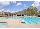 Community pool featuring lap lanes, mushroom water features, separate wading pool, and covered cabana for residents at 509 Azalea Bloom Dr, Loganville, GA 30052